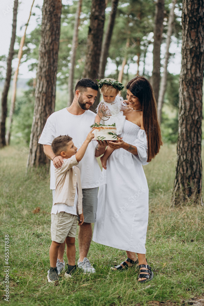 Family with baby girl and little son celebrating birhtday party Family with baby girl and little son celebrating birhtday party