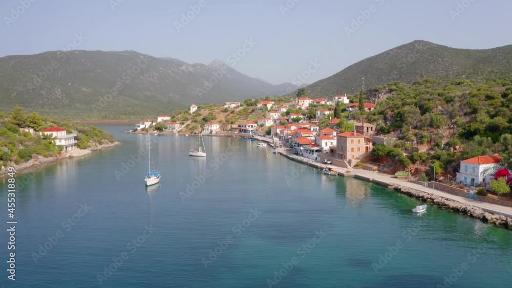 4k drone forward video (Ultra High Definition) of Limin Ieraka village. Sunny summer scene of Peloponnese peninsula, Greece, Europe. Calm morning seascape of Ionian sea. Traveling concept background.. 4k drone forward video (Ultra High Definition) of Limin Ieraka village. Sunny summer scene of Peloponnese peninsula, Greece, Europe. Calm morning seascape of Ionian sea. Traveling concept background..