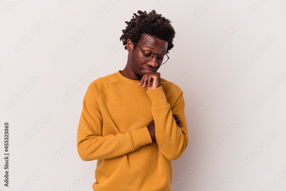 Young african american man isolated on white background looking sideways with doubtful and skeptical expression. Young african american man isolated on white background looking sideways with doubtful and skeptical expression.