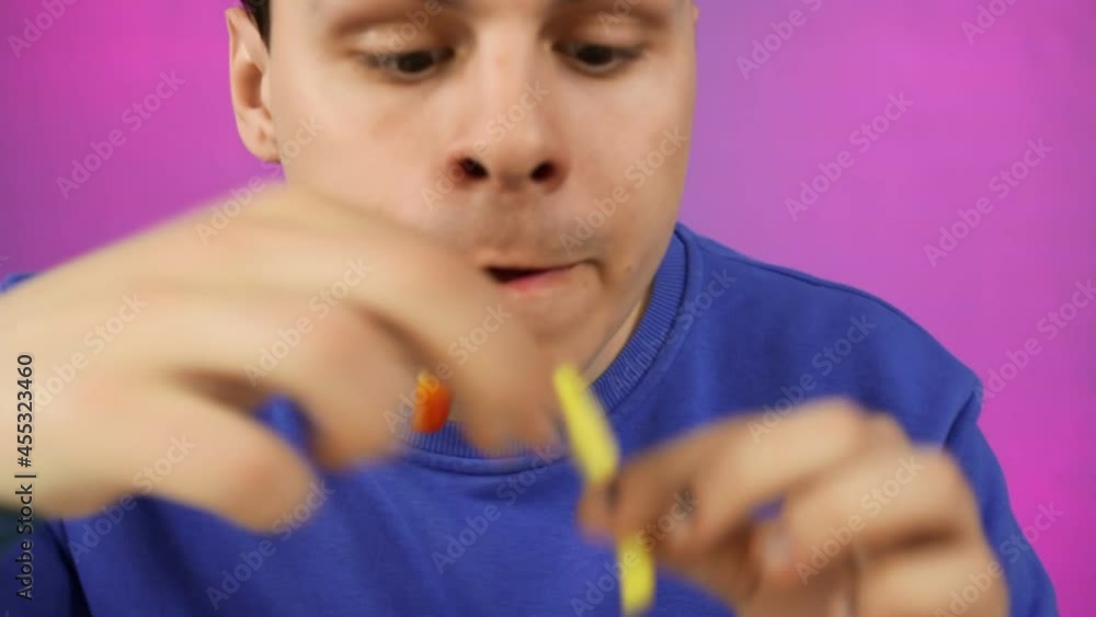 A man is having fun with fries. Party. A man is having fun with fries. Party.