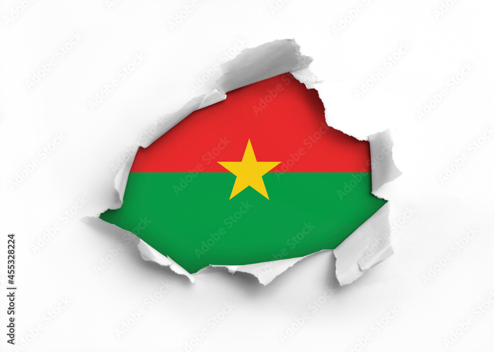Flag of Burkina Faso underneath the ripped paper Flag of Burkina Faso underneath the ripped paper