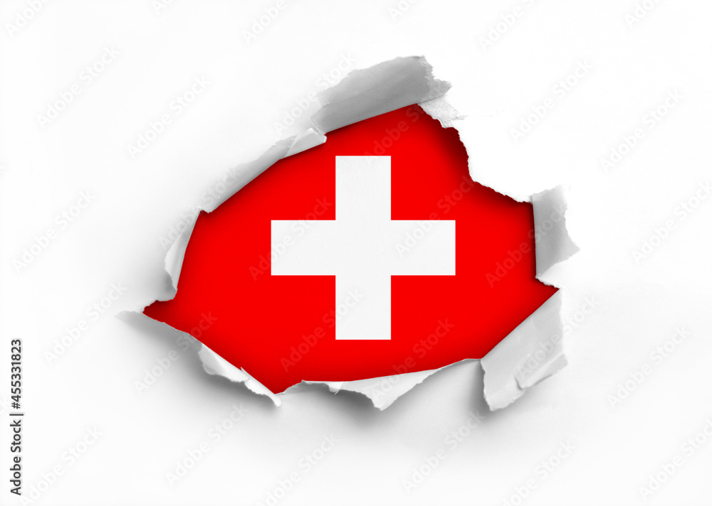 Flag of Switzerland underneath the ripped paper Flag of Switzerland underneath the ripped paper