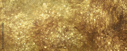 Gold Sparkling Lights Festive Background With Texture. Abstract Christmas Twinkled Bright Bokeh Defocused And Falling Stars. Winter Card Or Invitation Texture Background Banner Wallpaper