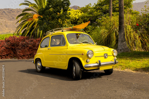 Fototapeta Naklejka Na Ścianę i Meble -  Yellow vintage car.  SEAT 600 1969
Surfing ride
