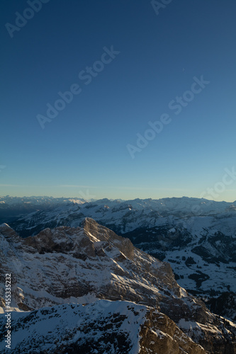 Amazing sunset at the top of one of the most impressive mountain in Switzerland called S  ntis. Epic view over several cantons in Switzerland. Flying birds in front of the lens.
