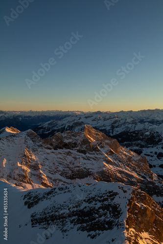 Amazing sunset at the top of one of the most impressive mountain in Switzerland called S  ntis. Epic view over several cantons in Switzerland. Flying birds in front of the lens.