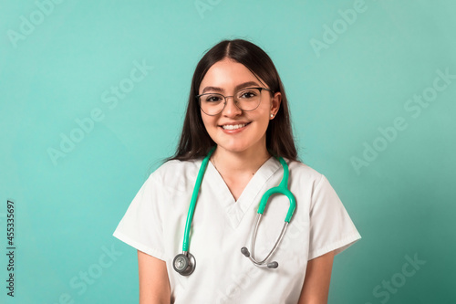 portrait of a smiling young latinx woman medical student. photo