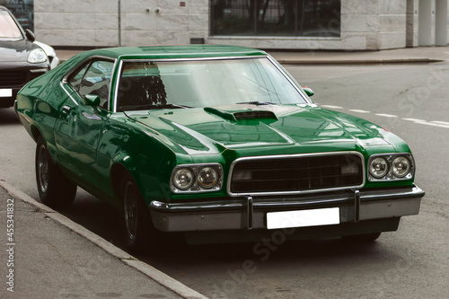 muscle car street green color empty license plate © evgris