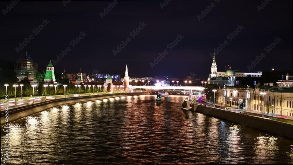 time-lapse with motor ships floating on the night river against the background of the night city and the old Kremlin time-lapse with motor ships floating on the night river against the background of the night city and the old Kremlin