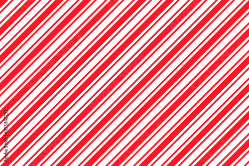 Candy cane striped pattern. Seamless Christmas red background. Peppermint wrapping texture. Cute caramel package print. Xmas holiday diagonal lines. Abstract geometric backdrop. Vector illustration.