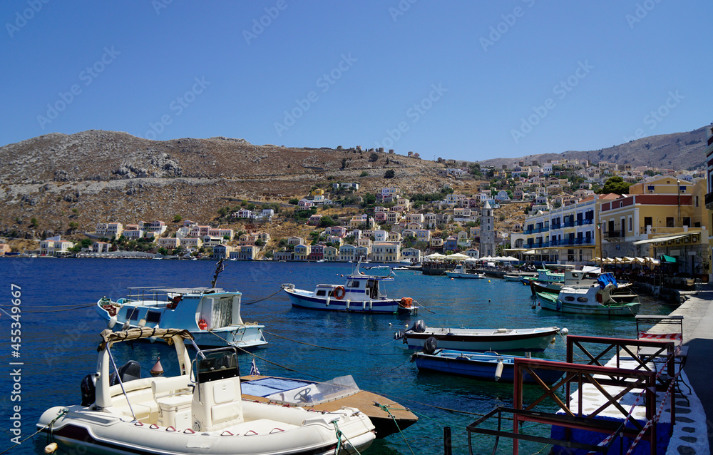 small boat in the harbor of symi small boat in the harbor of symi