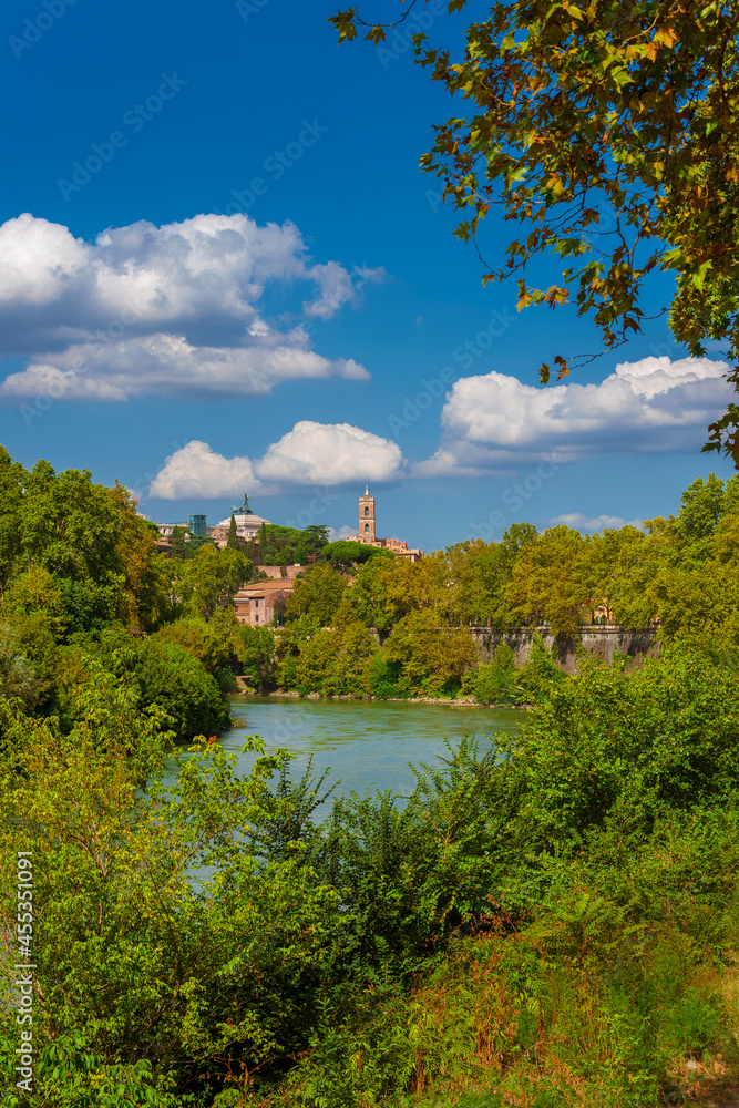 Nature in Rome. View of the city old historic center from River Tiber embankment full of trees