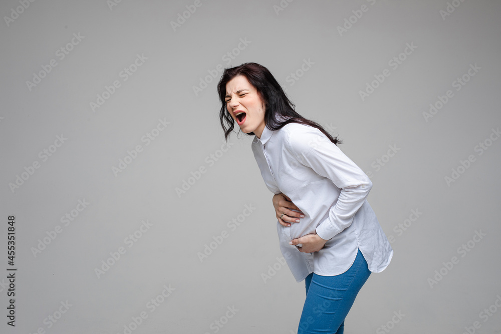 Screaming pregnant woman embracing tummy. Screaming pregnant woman embracing tummy.