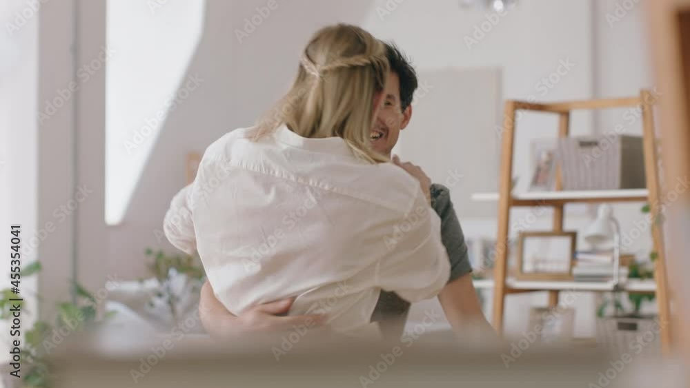 happy couple hugging excited woman embracing boyfriend enjoying romantic relationship at home celebrating good news 4k happy couple hugging excited woman embracing boyfriend enjoying romantic relationship at home celebrating good news 4k