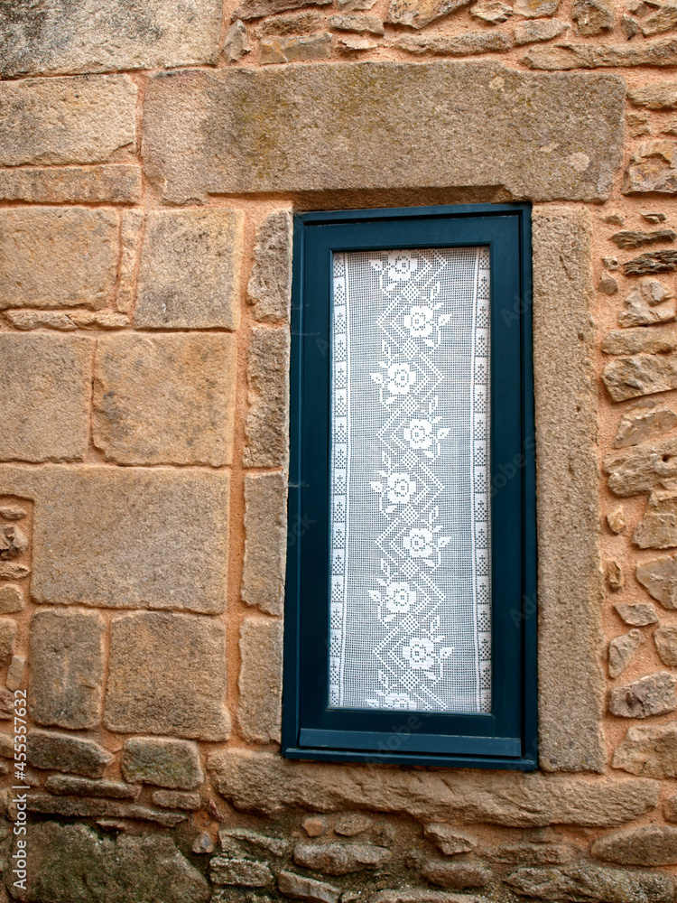 Traditional window with lace curtain in Castelo Rodrigo Traditional window with lace curtain in Castelo Rodrigo