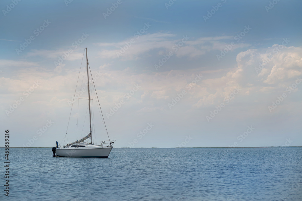 yacht at sea against a stormy sky
