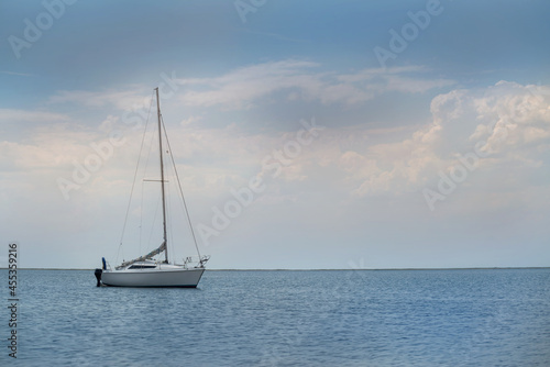 yacht at sea against a stormy sky © chebonenko