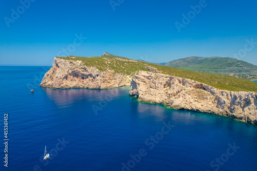 Fototapeta Naklejka Na Ścianę i Meble -  Aerial view of Capo Caccia next to Neptune Grotto in Alghero district, Sardinia