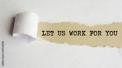 let us work for you. words. text on grey paper on torn paper background