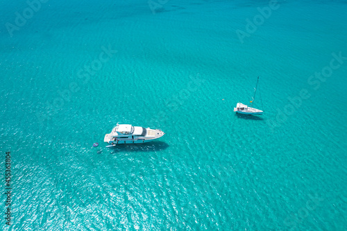 Aerial view of two yachts in turquoise water in Mediterranean Sea © Audrius