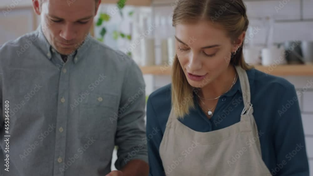 happy young couple cooking together in kitchen using smartphone browsing recipe online preparing dinner mixing ingredients enjoying healthy lifestyle making food at home 4k happy young couple cooking together in kitchen using smartphone browsing recipe online preparing dinner mixing ingredients enjoying healthy lifestyle making food at home 4k