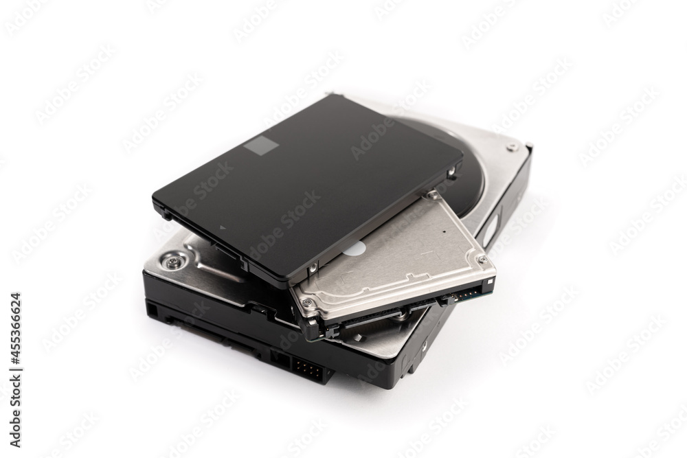Pile of a variety of computer Hard disk drive HDD and SSD isolated on white background. Computer hardware data storage Pile of a variety of computer Hard disk drive HDD and SSD isolated on white background. Computer hardware data storage