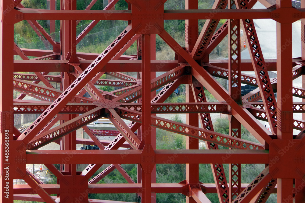 Partial view of the red painted steel under construction of the San Francisco Golden Gate bridge at the northern end