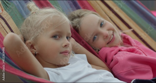 Vászonkép two sisters having rest in hammock