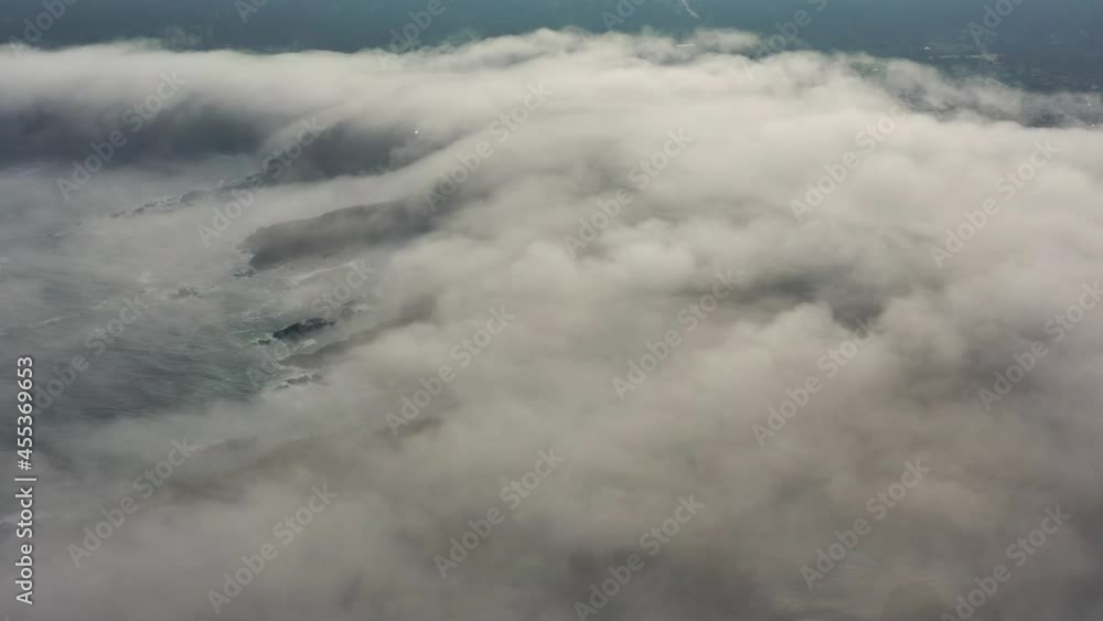 Fog drifts over the rugged, rocky coast of Mendocino, California. The foggy marine layer is generated by a pressure gradient as a result of warmer inland temperatures. Fog drifts over the rugged, rocky coast of Mendocino, California. The foggy marine layer is generated by a pressure gradient as a result of warmer inland temperatures.