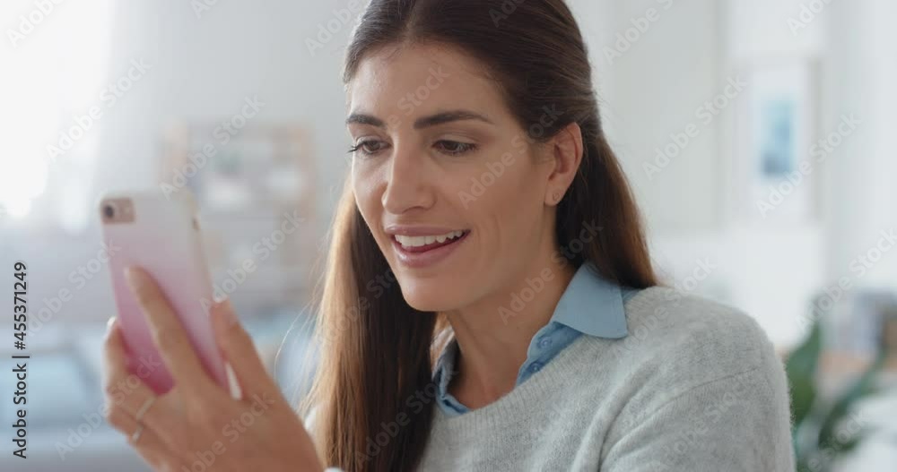 happy woman having video chat using smartphone at home showing off hairstyle chatting sharing exciting lifestyle enjoying online communication 4k happy woman having video chat using smartphone at home showing off hairstyle chatting sharing exciting lifestyle enjoying online communication 4k