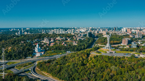 Aerial view to the Beautiful cityscape city Kiev in sunny day. Top view to the urban landscape. Panorama of a big european city.