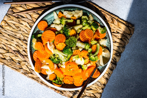 Plate of steamed beans, carrots, broccoli and cauliflower photo