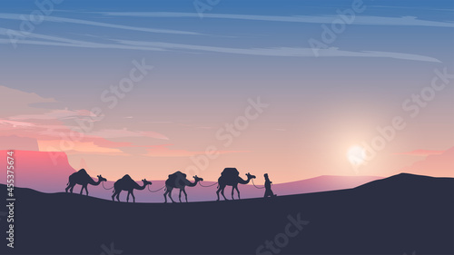 caravan of camels at sunset arabic desert