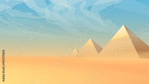 desert landscape with ancient pyramids at sunset