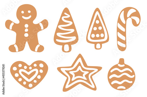 Set of gingerbreads in different shapes: star, Christmas tree, heart, gingerbread man, candy canes, ball. Vector hand drawn elements isolated on white background.