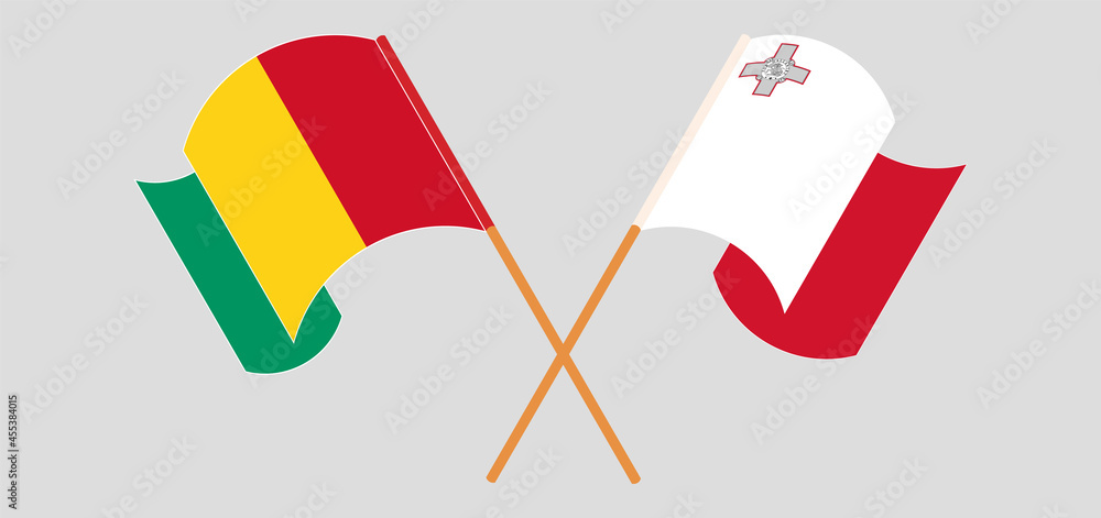 Crossed and waving flags of Guinea and Malta Crossed and waving flags of Guinea and Malta