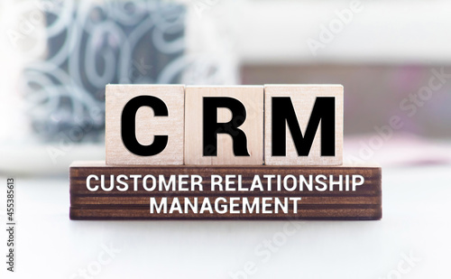 business concept. CRM - Customer Relationship Management. wooden block