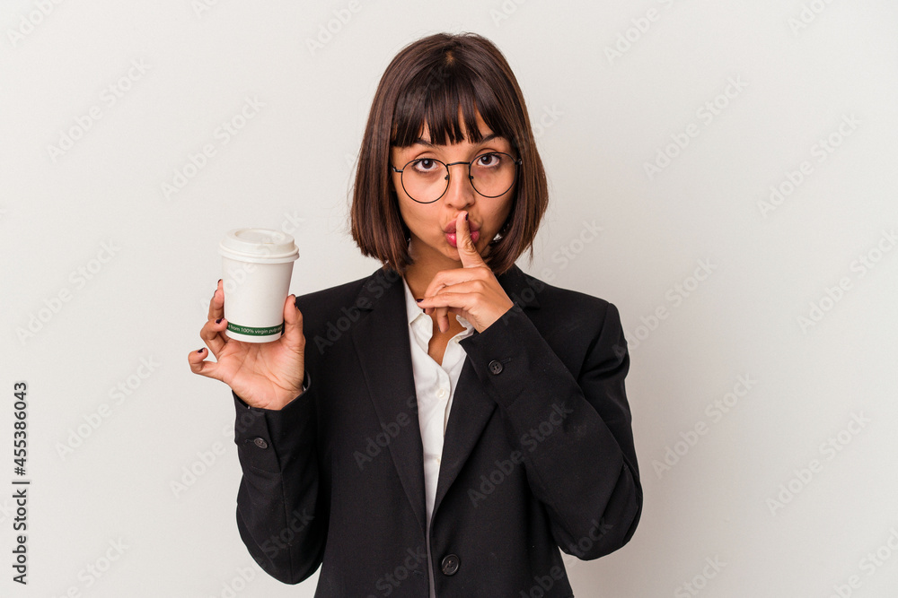 Young mixed race business woman holding a coffee isolated on white background keeping a secret or asking for silence. Young mixed race business woman holding a coffee isolated on white background keeping a secret or asking for silence.