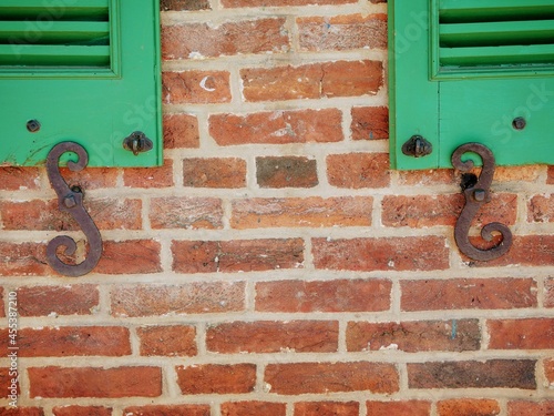 Green Shutters with Cast Iron on Brick 