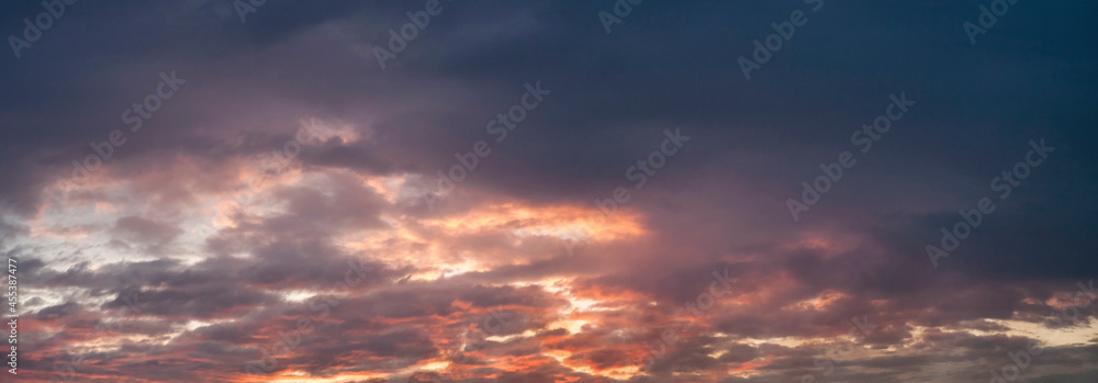 Purple cumulus clouds at sunset