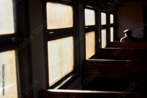 Old man on train. Lonely passenger at window. Railroad trip