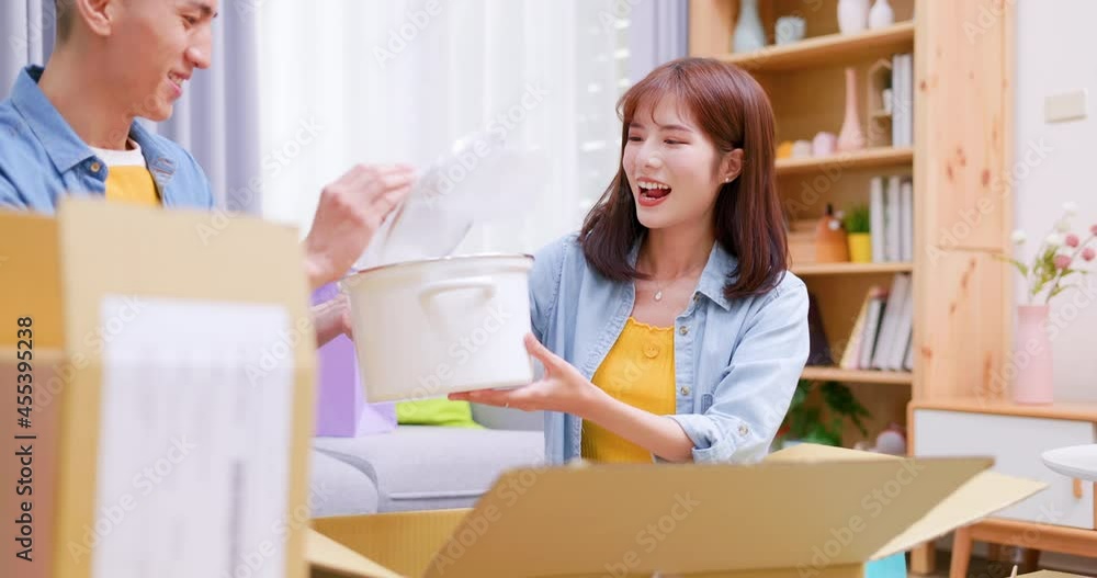couple open delivery boxes couple open delivery boxes