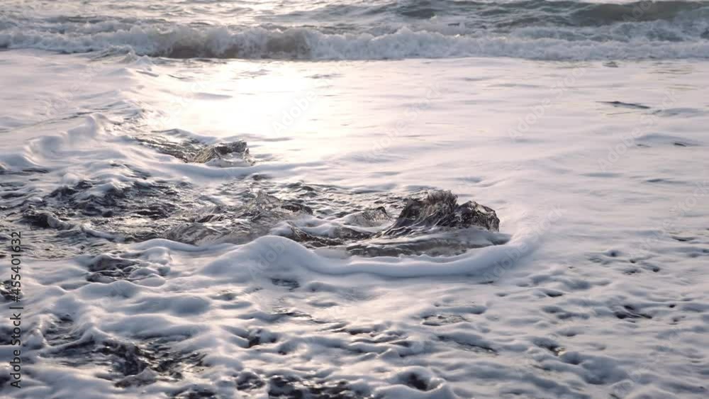 surf covering ice on Diamond Beach of Iceland surf covering ice on Diamond Beach of Iceland