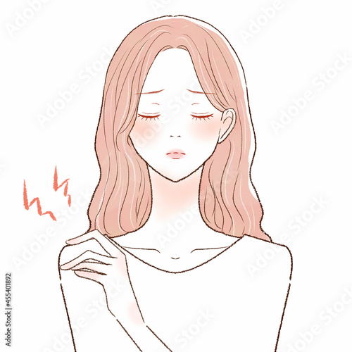 肩こりに悩まされる女性