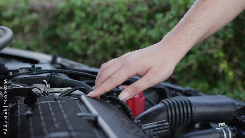 slow motion scene technician man checking problem on car machinery in the auto repair at home for small business and industry concept slow motion scene technician man checking problem on car machinery in the auto repair at home for small business and industry concept
