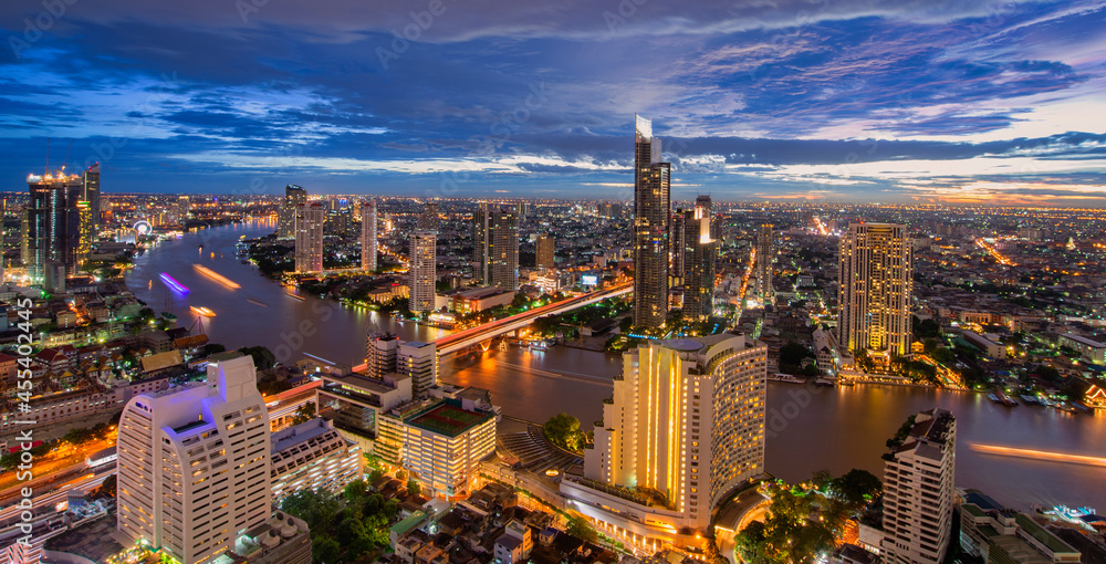 Fototapeta premium The scenic view curved of the Chao Phraya River in Bangkok city downtown at sunset, capital of Thailand