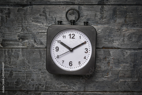 Wallpaper Mural A black watch with a white dial on a wooden background. Torontodigital.ca