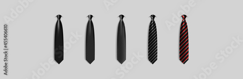 Set different black ties isolated on gray background. Colored tie for men