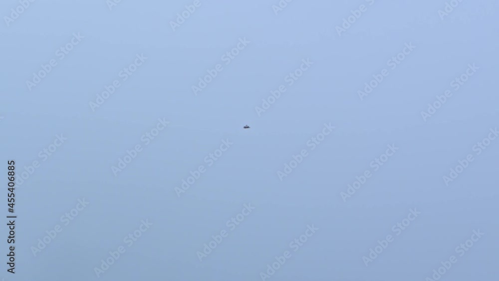Majestic bird of prey flying high in the sky, slow motion handheld view Majestic bird of prey flying high in the sky, slow motion handheld view