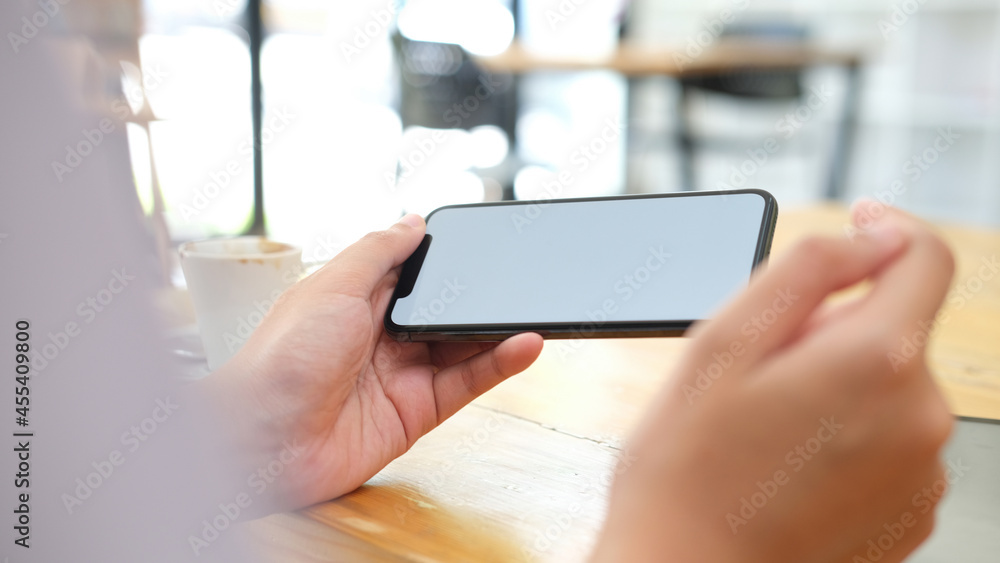 Close up of man hand holding smart phone. Close up of man hand holding smart phone.